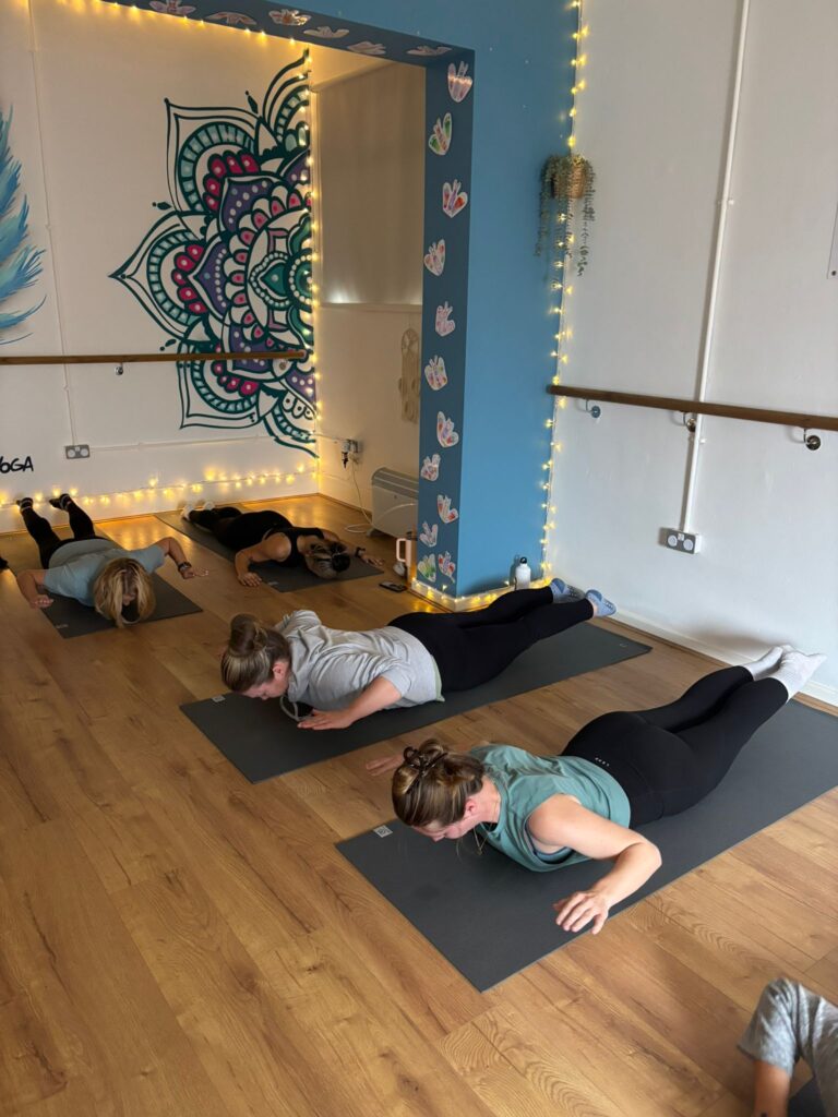 44b24a58-738d-4db4-9466-bae077292c56 Pilates class working on posture, alignment and balanced strength in Wigan