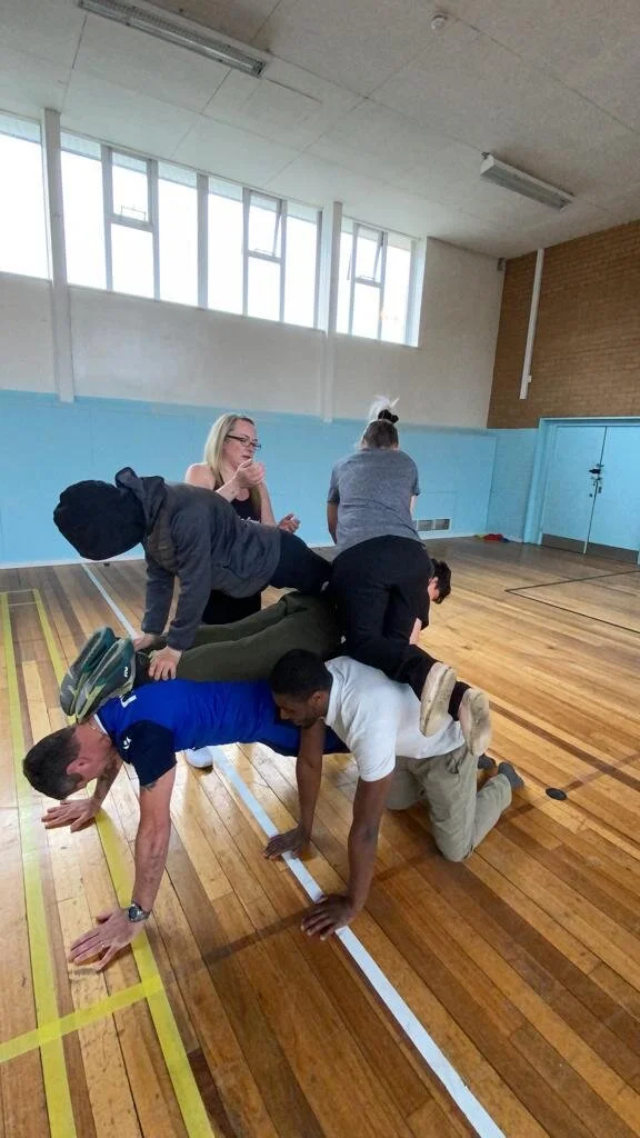 Children practising yoga and mindful movement in an Atherton primary school