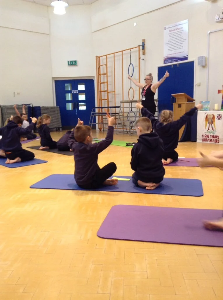 Kids practising fun yoga poses to build confidence and coordination in school