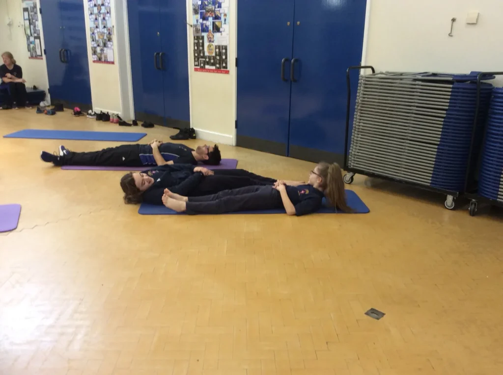 Children taking part in a school yoga session with Toni Marie Yoga in Bolton